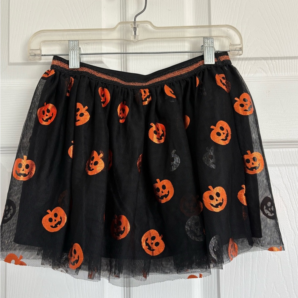 Size large 10/12 celebrate Halloween black skirt with orange metallic pumpkins